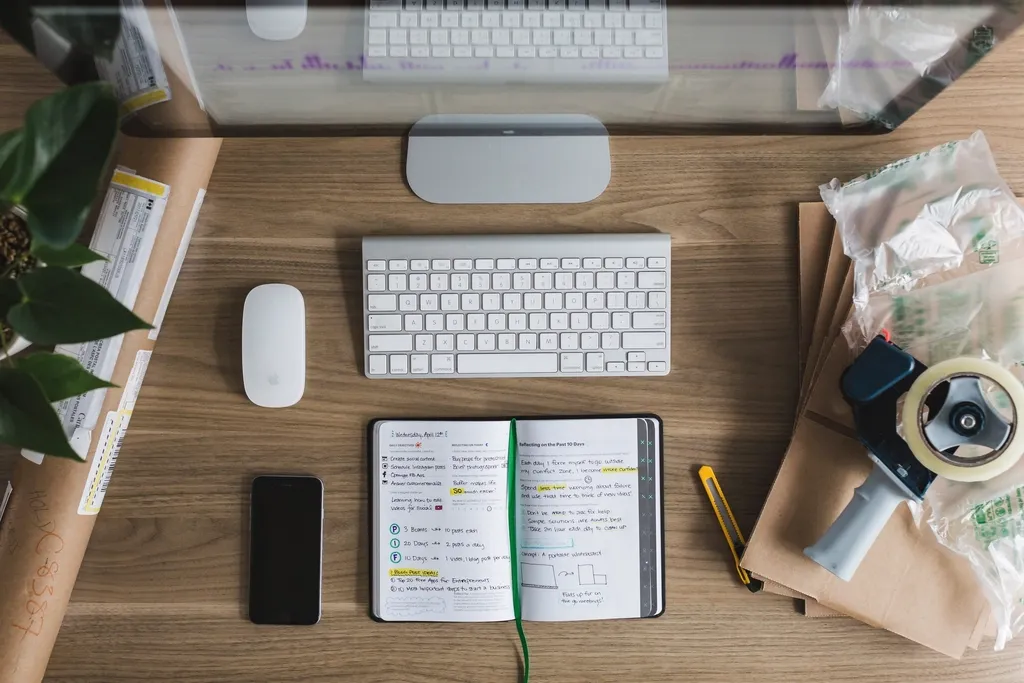 Designer's desk with notebook and keyboard